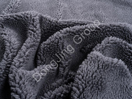 How breathable is the black gray rolling ball cloth faux fur fabric?